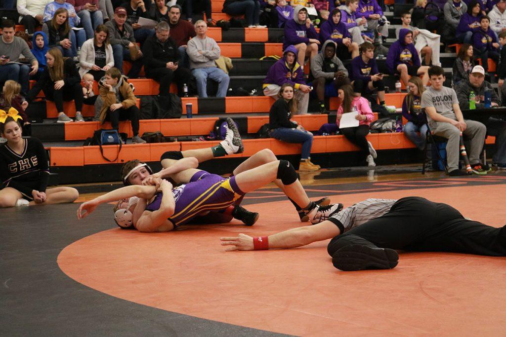 Jack Streicher prepares to pin his opponent at sectionals wresting in Solon. Streicher ended up placing second and will be moving on to districts. Photo by Paige Zaruba. 