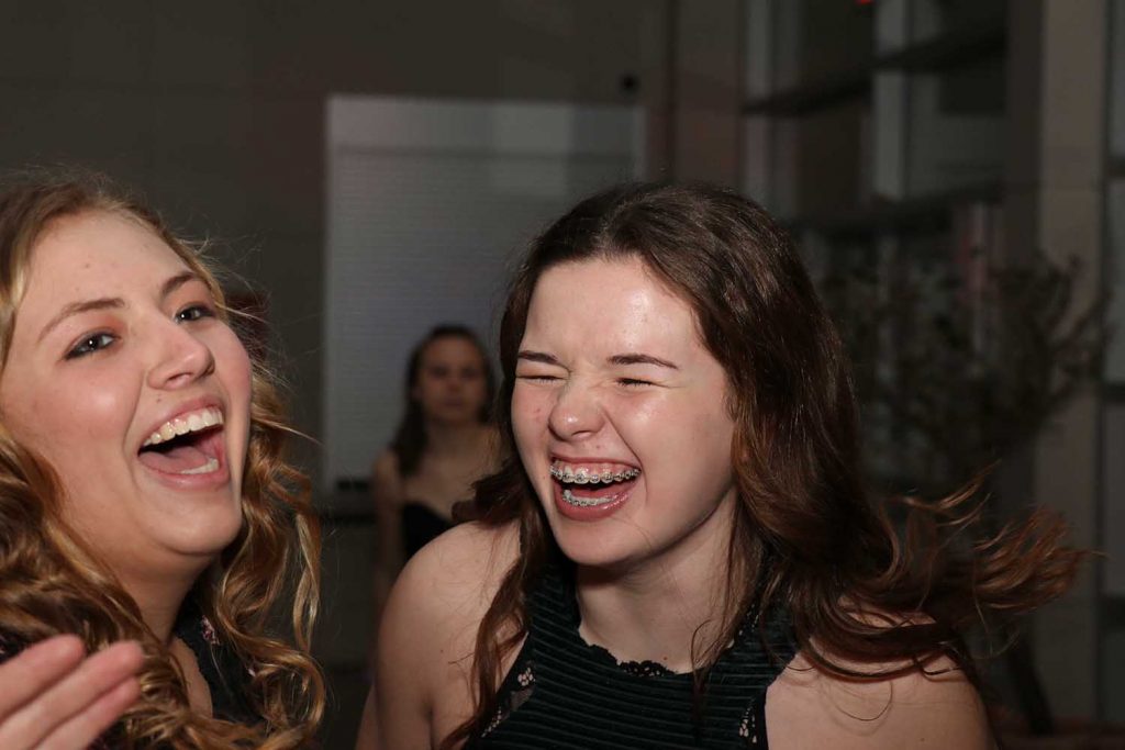 Sharing a laugh at the winter formal are Junior Kenzie Ketchum and sophomore Paige Beck. 