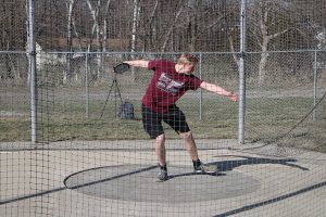 Matt Vislisel prepares to release the discus at the track meet at Solon on April 17. Photo by Maddie Naeve. 