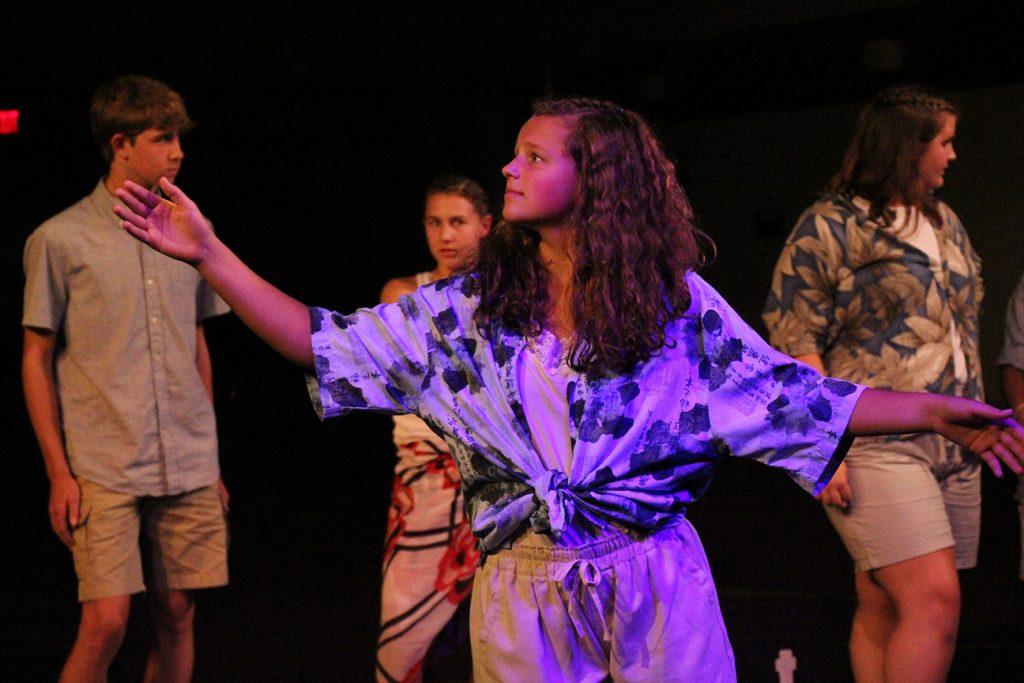 Senior Alina Merlak dances to a song during Dress Rehearsal for Once on This Island. Photo by Maddie Naeve.