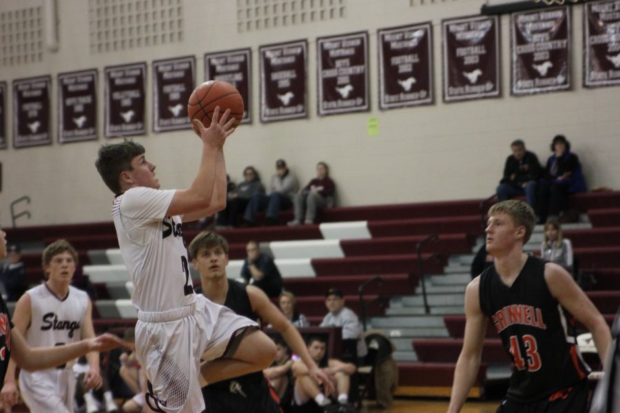 Collin Swantz takes a shot Thursday night against Grinnell. Photos by Maddie Naeve.
