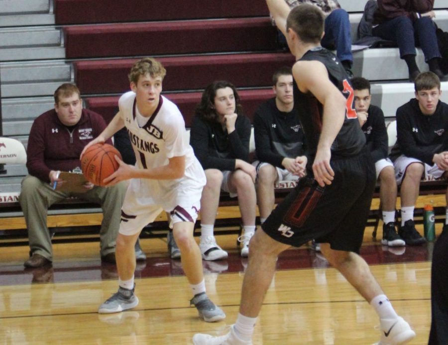 Nolan Brand prepares to drive to the basket against West Delaware.