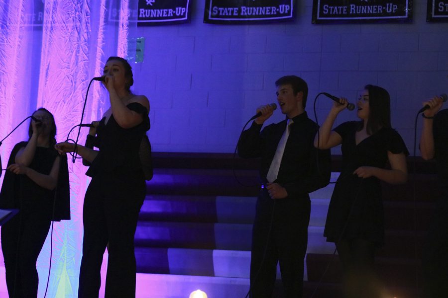 Senior Adrienne Hill sings along side the Lincoln Highway Jazz Choir at Java Jazz on March 12.