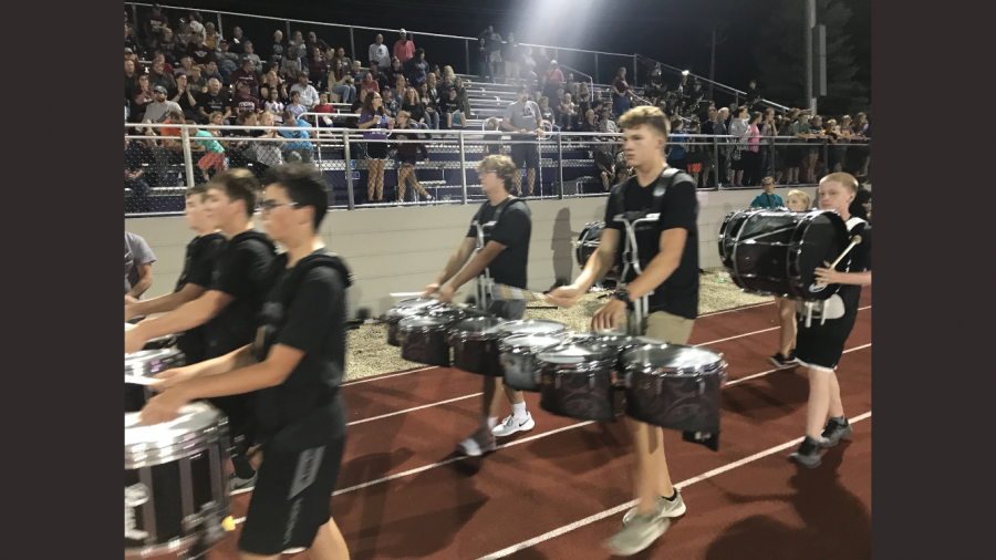 Derek+Jordan+behind+the+drums+for+the+Marching+Mustangs.