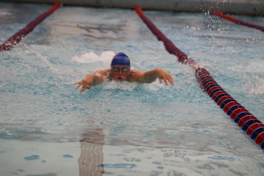 Sophomore Sydney Jones swims in the 100m butterfly race in a home meet at Cedar Rapids Washington High School on Aug. 28. 