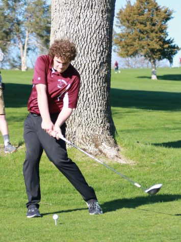 Freshman Steven Wolfe drives off the tee on hole seven at Kernoustie Golf Course.