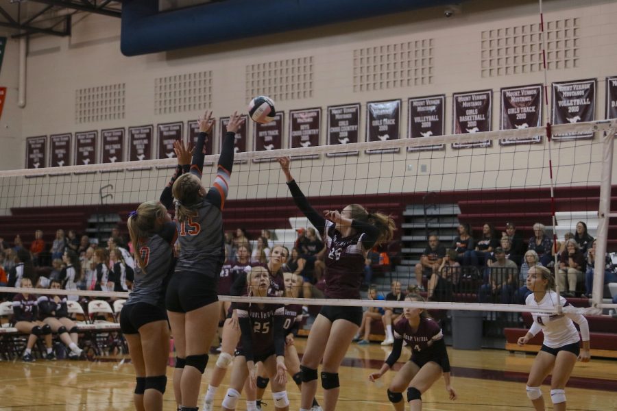 Junior Anna Nydegger tips a ball over the block from the outside during the JV game against West Delaware. 