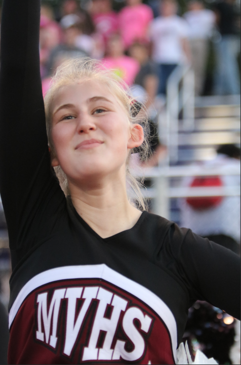 Cheering Loud! Junior Megan Baumler seen celebrating the first touchdown of the Mustangs at Ash Park on Sept. 20. Photo by Evan Wilch.