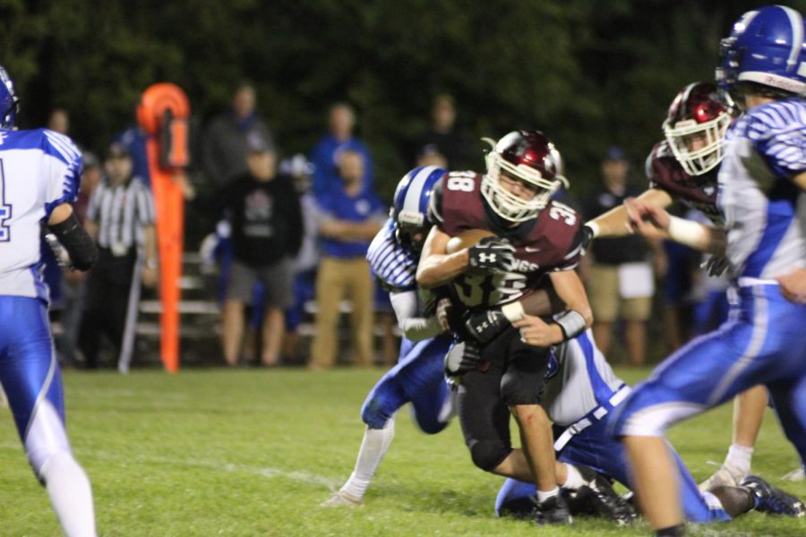 Sophomore Trenton Pitlik runs the ball against West Liberty at the homecoming game Sept. 26. The Mustangs won 31-14.