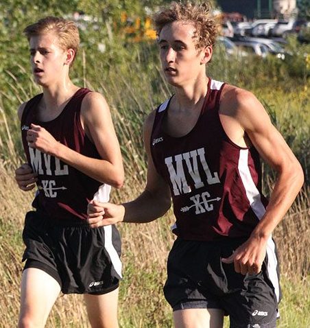 Senior Kaleb Brand and Freshman Zach Fall running side be side at the home meet aug 27. 