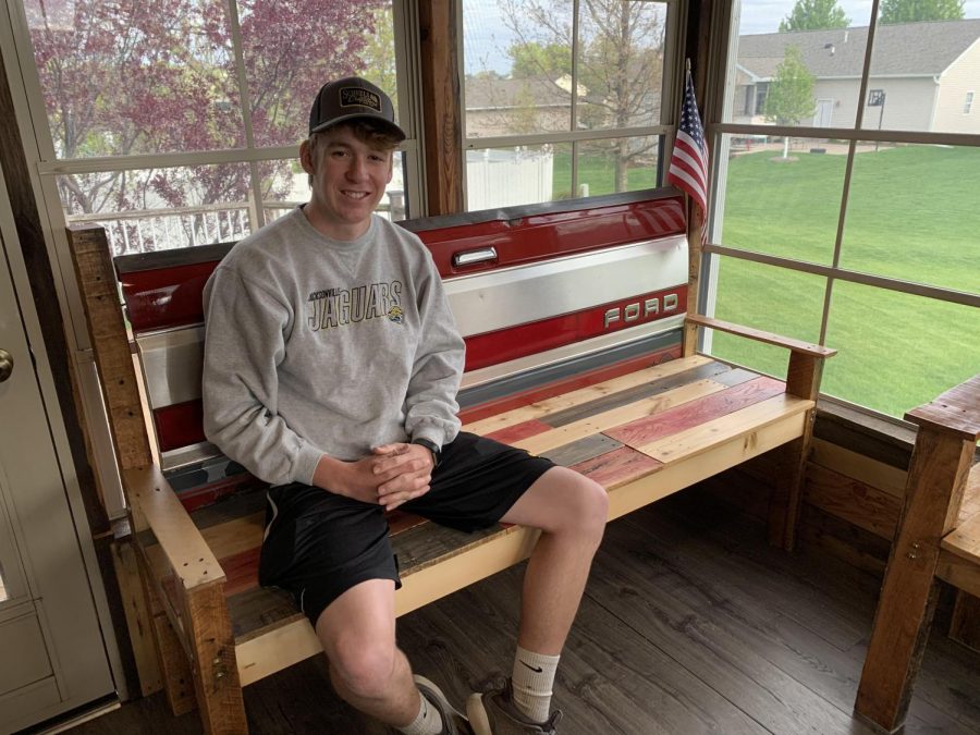 The Brand brothers made seven benches and sold five. Here Nolan poses with a bench he made that his family is keeping.