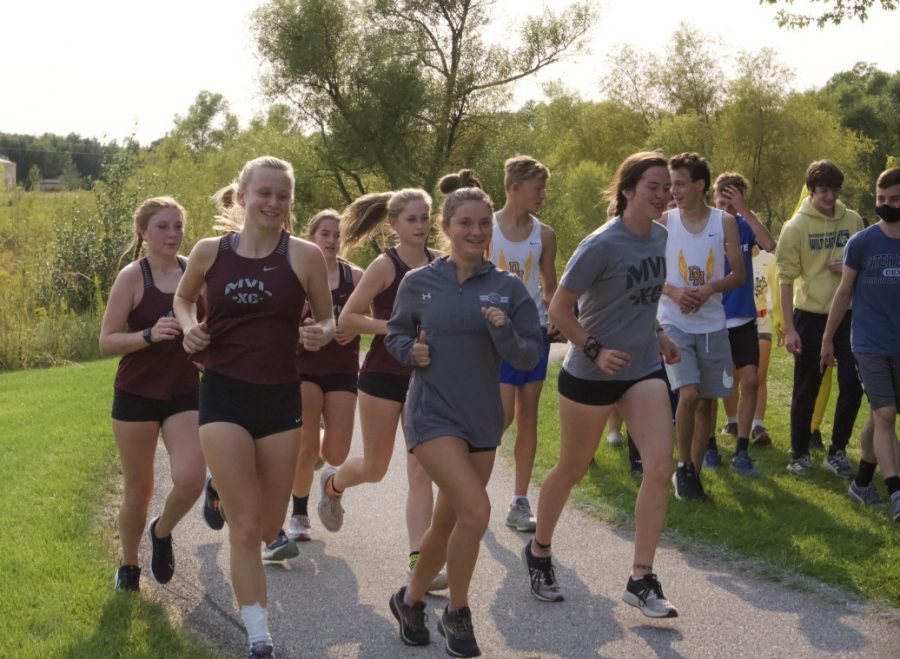 PRE MEET WARM UP
Varsity girls jog around the course before they place 4th at the Solon XC meet on Sept. 21.