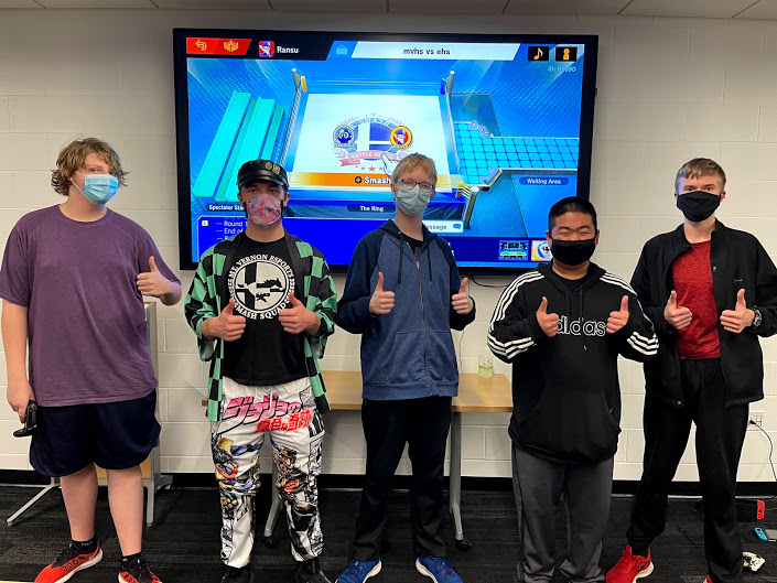 Esports players Logan Eriksen, Jasper Rood, Lance Eriksen, Eli Krob and pose for a photo at their competition Nov. 19.