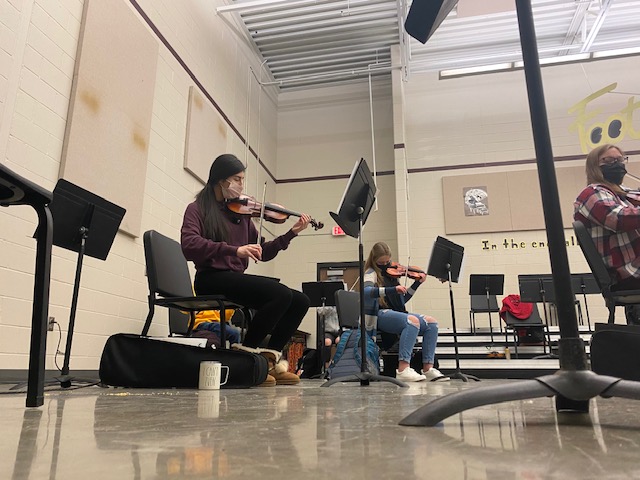 Julissa Govea (11) warms up her violin before orchestra class on Jan. 7. 
