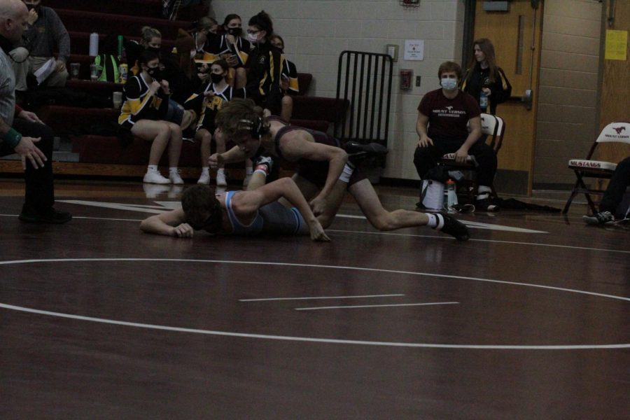 Sophomore Henry Ryan comes out on top in a scramble at Mount Vernon on Jan. 7. 