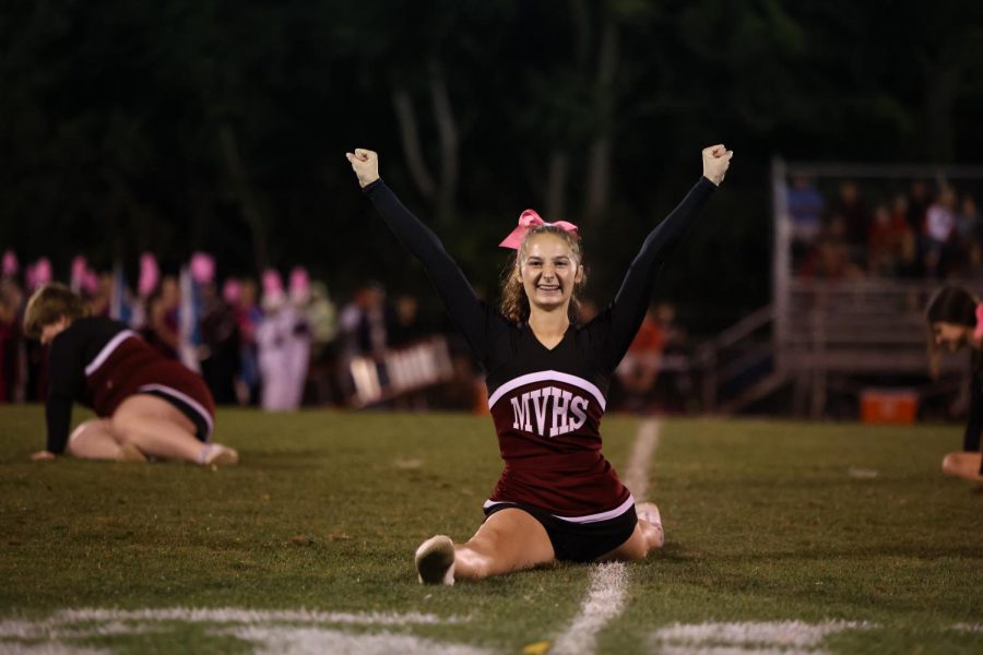 Sophomore Emily patten ends the halftime cheer performance in the splits. Oct. 1. 