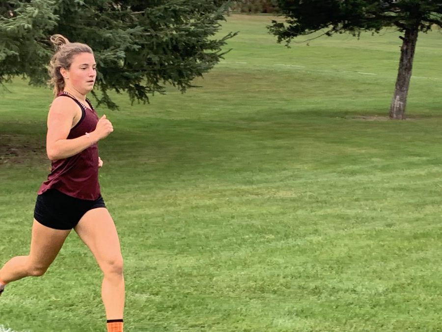 Junior Laura Swart runs in the cross country meet Oct. 5 in the West Delaware Invitational at Hunt Ridge Golf Course in Manchester. Swart placed second with a time of 19:42. The girls placed second out of 25 teams.
