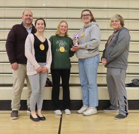 The academic decathlon team poses at their regional competition Jan. 26: Coach Rich Eskelsen, junior Claire Gaffney, senior Lily Booth, senior Macy Eskelsen, and sophomore Landon Miksch. 