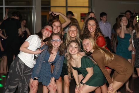 Dancers pose together at the Winter Formal Feb. 5 in the high school commons.
