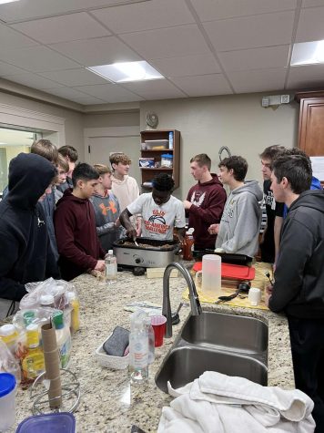 The Basketball Team prepares food for the Mission of Hope.  Feb 10. 
