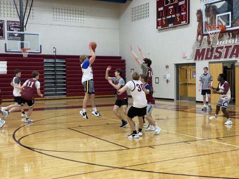 Senior Adam Deebs jump shot gave the white team a narrow lead in the third quarter of the Varsity Reserve Extravaganza Feb. 1. The maroon team won the scrimmage, 108-84.