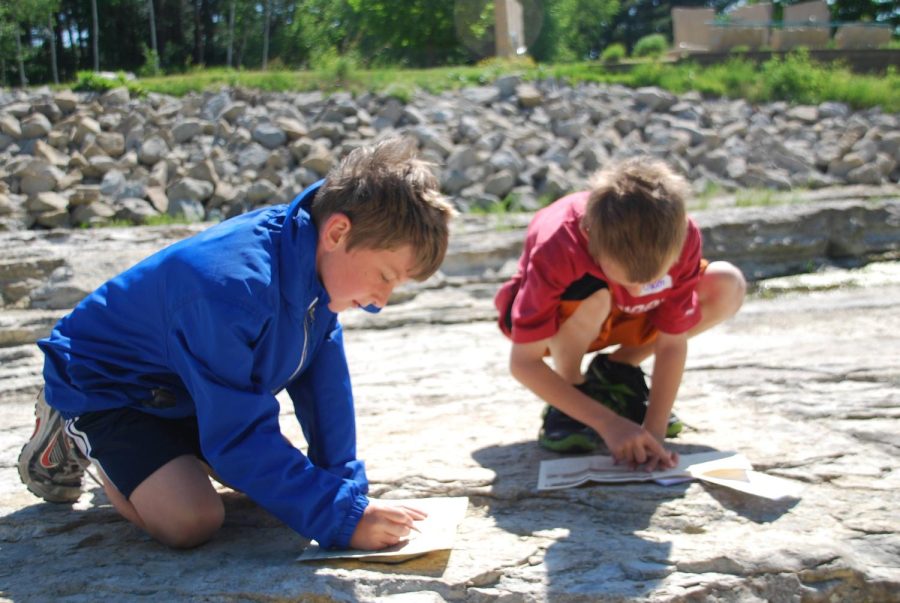 Aden Grudzinski and Owen Brase look for fossils at the Devonian Gorge.