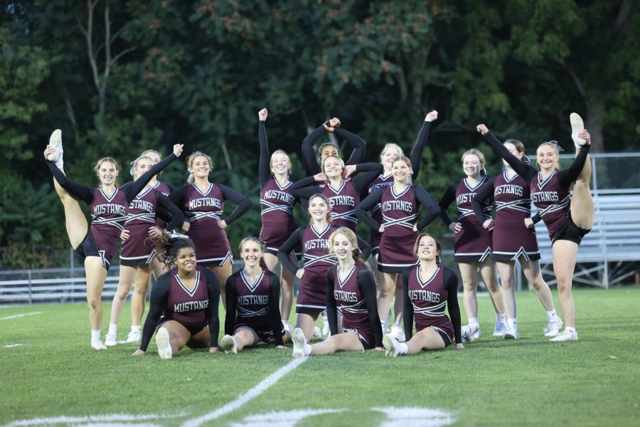 The cheer team strikes a pose at the end of their Homecoming performance.