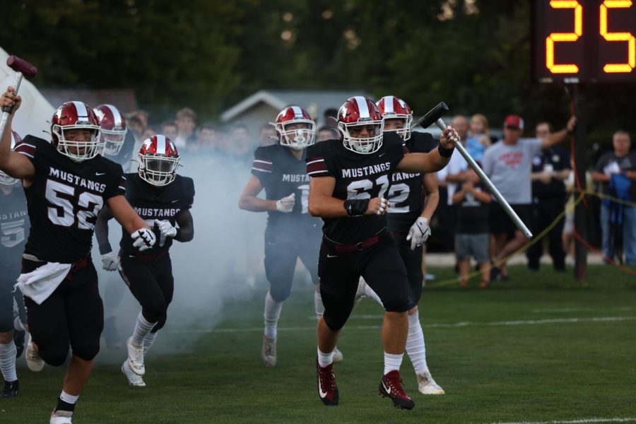 Seniors Clayton Flack (52) and Clark Younggreen (61) lead the team on to have an amazing night.