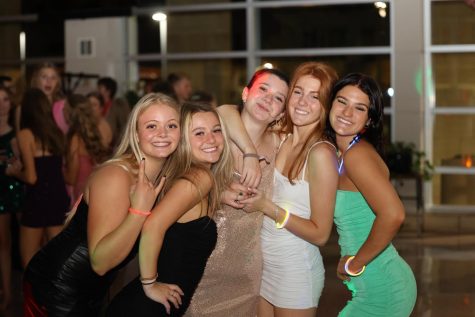 Kennedy Hunter, Bella Stimmel, Lilly Krob, Jordan Holtz, and Amelia Hartl are all smiles at the homecoming dance.