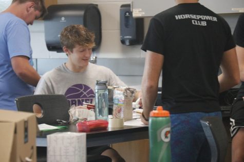 Senior Jensen Meeker Working on his collage prep physics project Egg drop Sept. 6. 