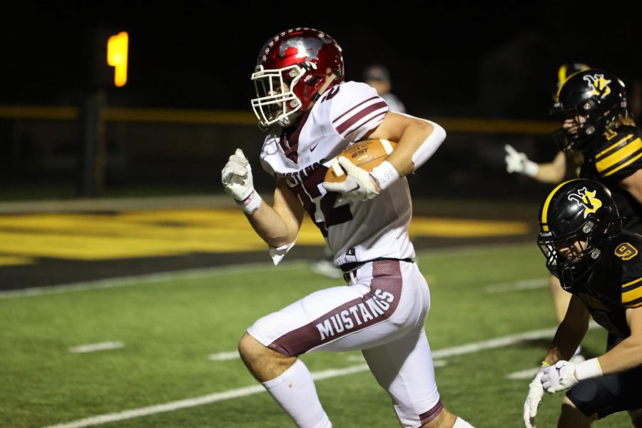 Sophomore Ethan Wood (22) scores his first varsity touchdown.