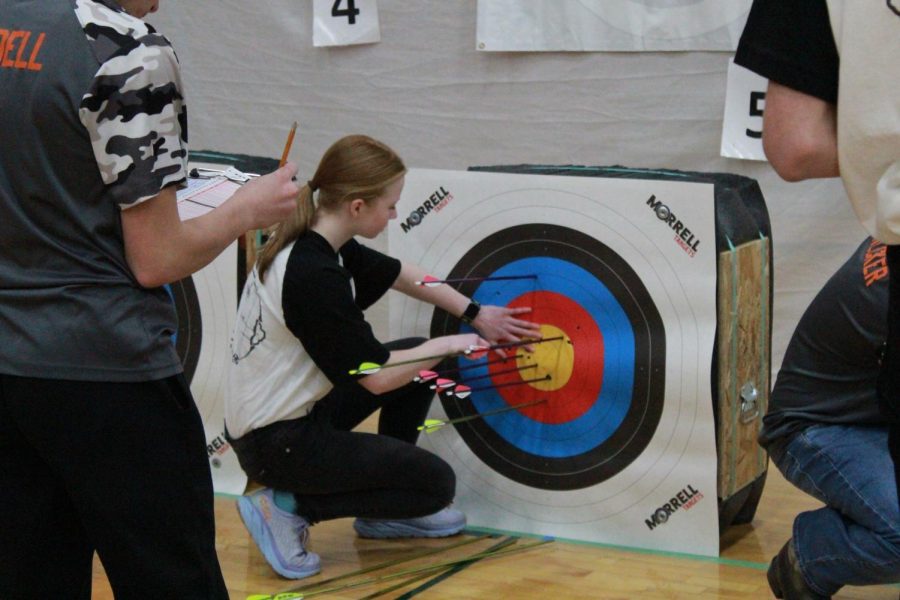 Freshmen Ingrid Morf pulling her arrows after a great round at 10 meters on Feb 4. 