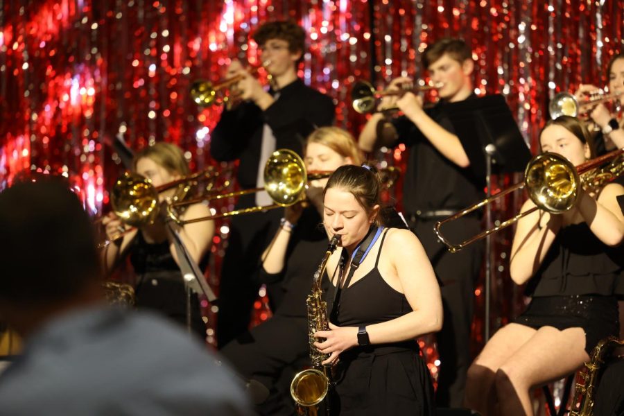 Junior Marin Denes performs her saxophone solo in the jazz band, marking her first year participating in the activity.