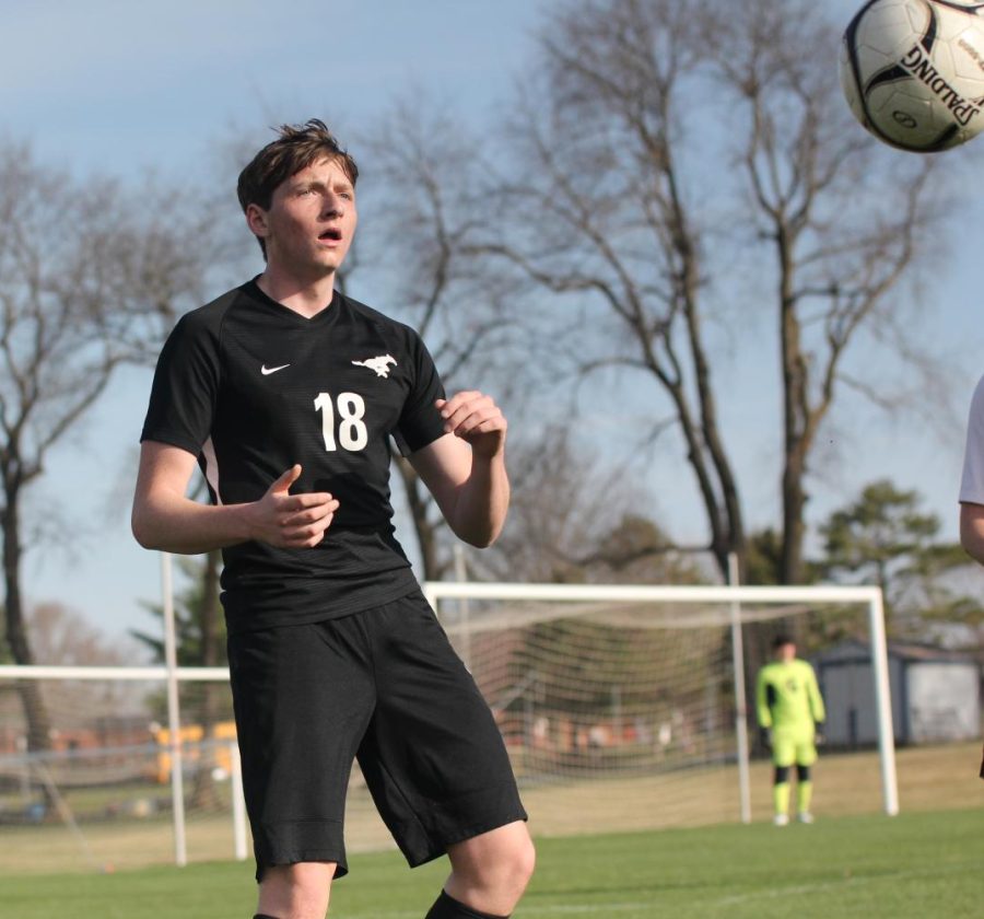 Senior Ben Nydegger catches the ball for a throw in during the game against Solon on April 11. Mount Vernon won 2-0 with goals from Aiden Campbell and Jason Hoagland. 