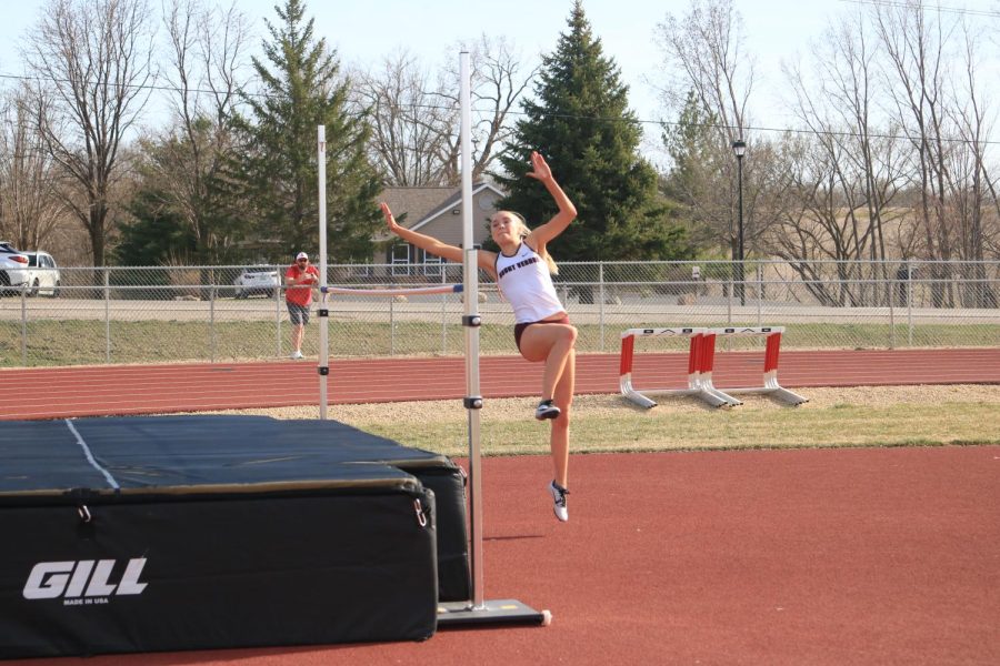 Sophomore Paige Schurbon bounds over the pole in high jump, pushing herself into 4th place, helping Mount Vernon win the Lisbon meet on Apr 11.