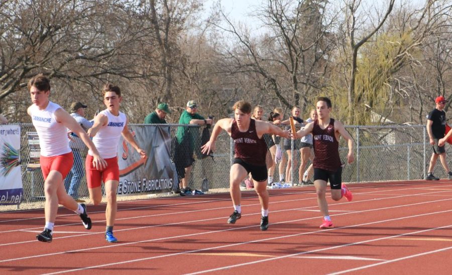Junior Jackson Hird accepts the handoff by sophomore Caleb Koon placing Mount Vernon in 1st in the 4x400-meter relay, and winning the Lisbon meet on Apr 11. 