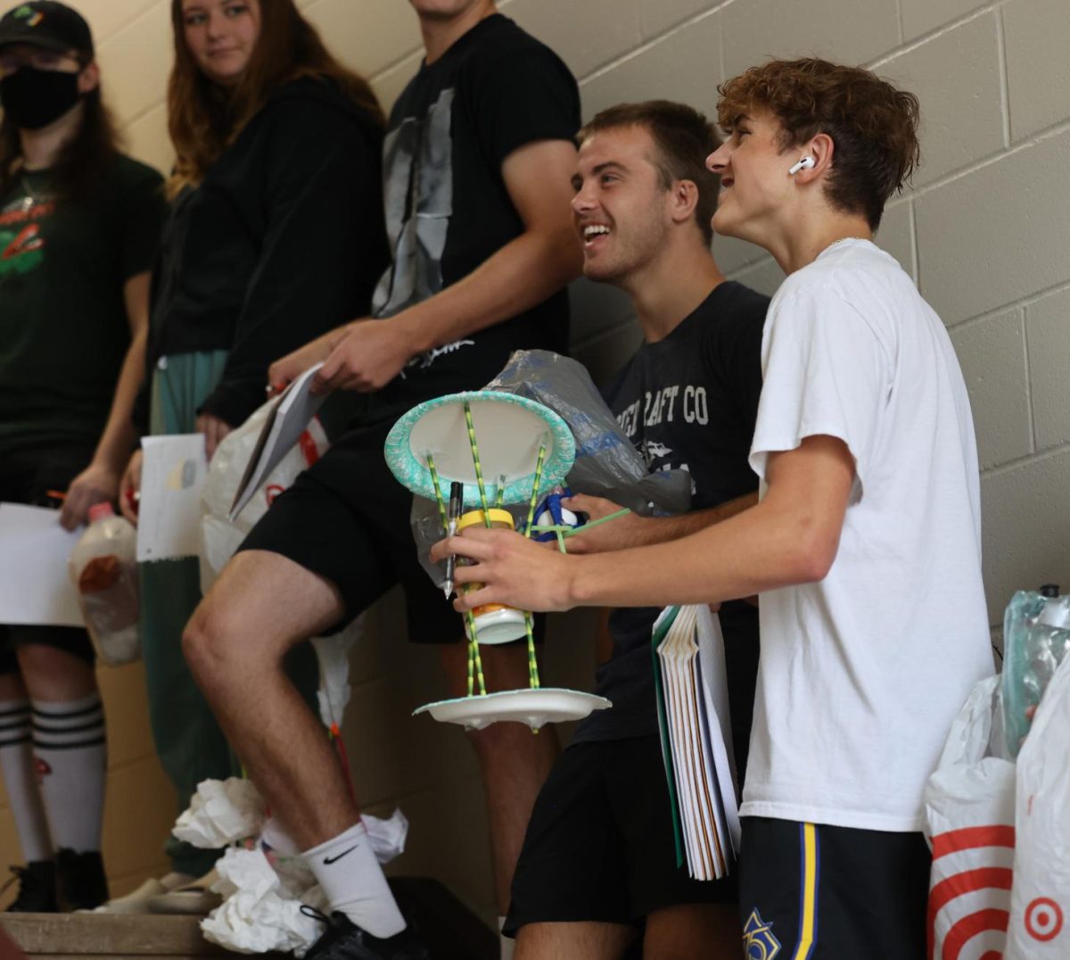 Seniors Jackson Jaspers and Jackson  Kutcher watch as Heather Allen drops another structure for their 3rd-hour physics class. Photo taken on Sept. 7