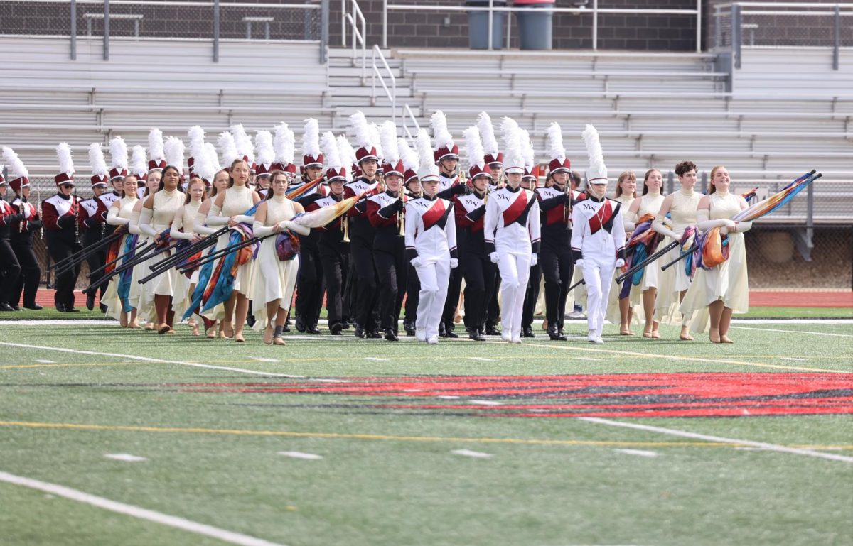 The Marching Mustangs enter the Linn-Mar field. They placed 6th at the marching band competition on Sept. 23.