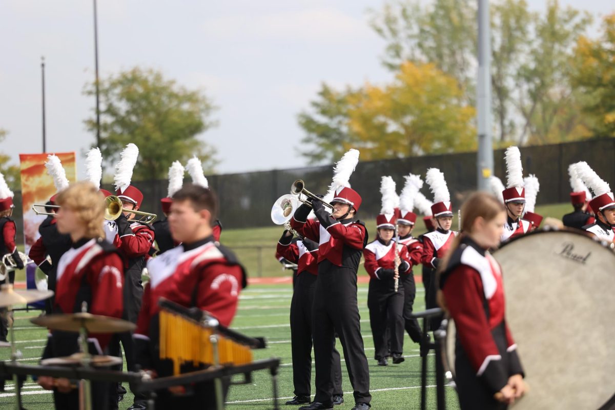 Senior Uwen Boettcher is focused in on his playing at the marching band competition.  