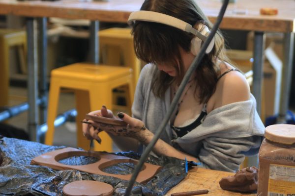 Junior Annaleaha Daugherty is enraptured by her ceramics project Aug. 31.