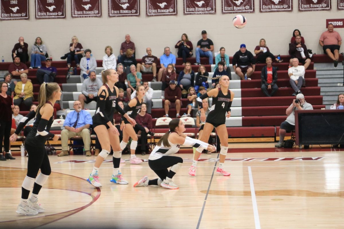 Junior Jaden Rolland bumps ball to teammate on Tuesday against Independence.