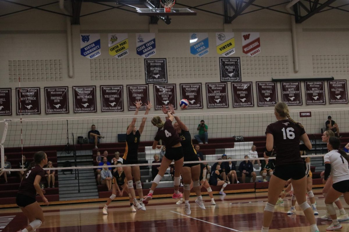 Junior Paige Schurbon hits the ball at the Shirley Ryan Invitational. The Mustangs beat Waverly-Shell Rock 2-0 (21-11, 21-2)