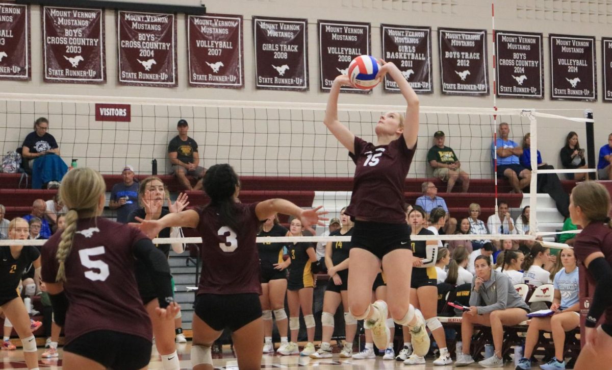 Junior Sydney Huber sets the ball to Sophomore Caliana Whitaker. The Mustangs beat Waverly-Shell Rock 2-0 (21-11, 21-2)