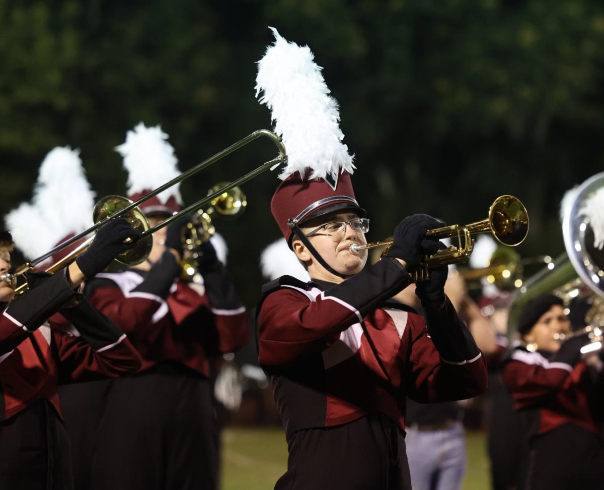 Junior Jack Simmons is focused on strutting with the other band members around him. 