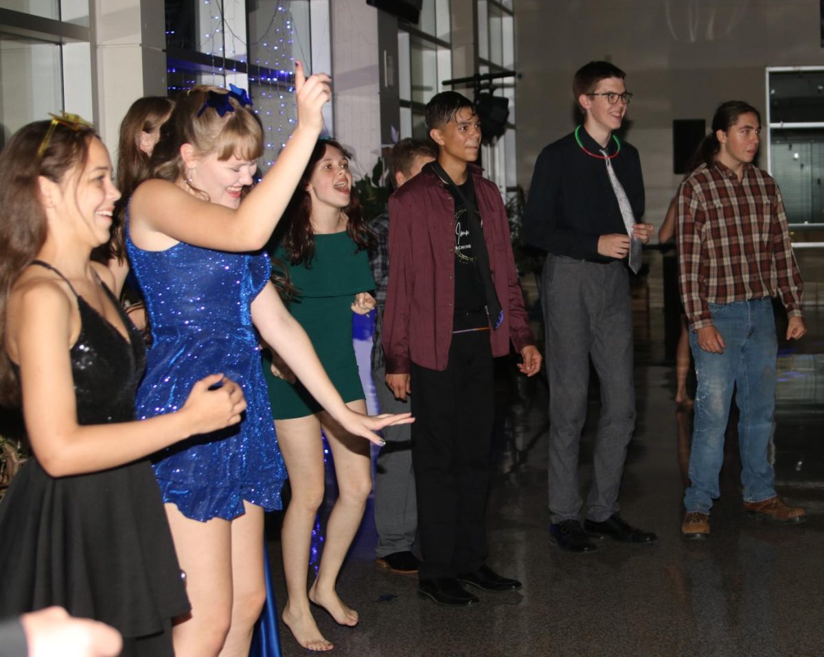 Mount Vernon students cheer on Kevin Zehms as he breaks it down on the dance floor at the homecoming dance.