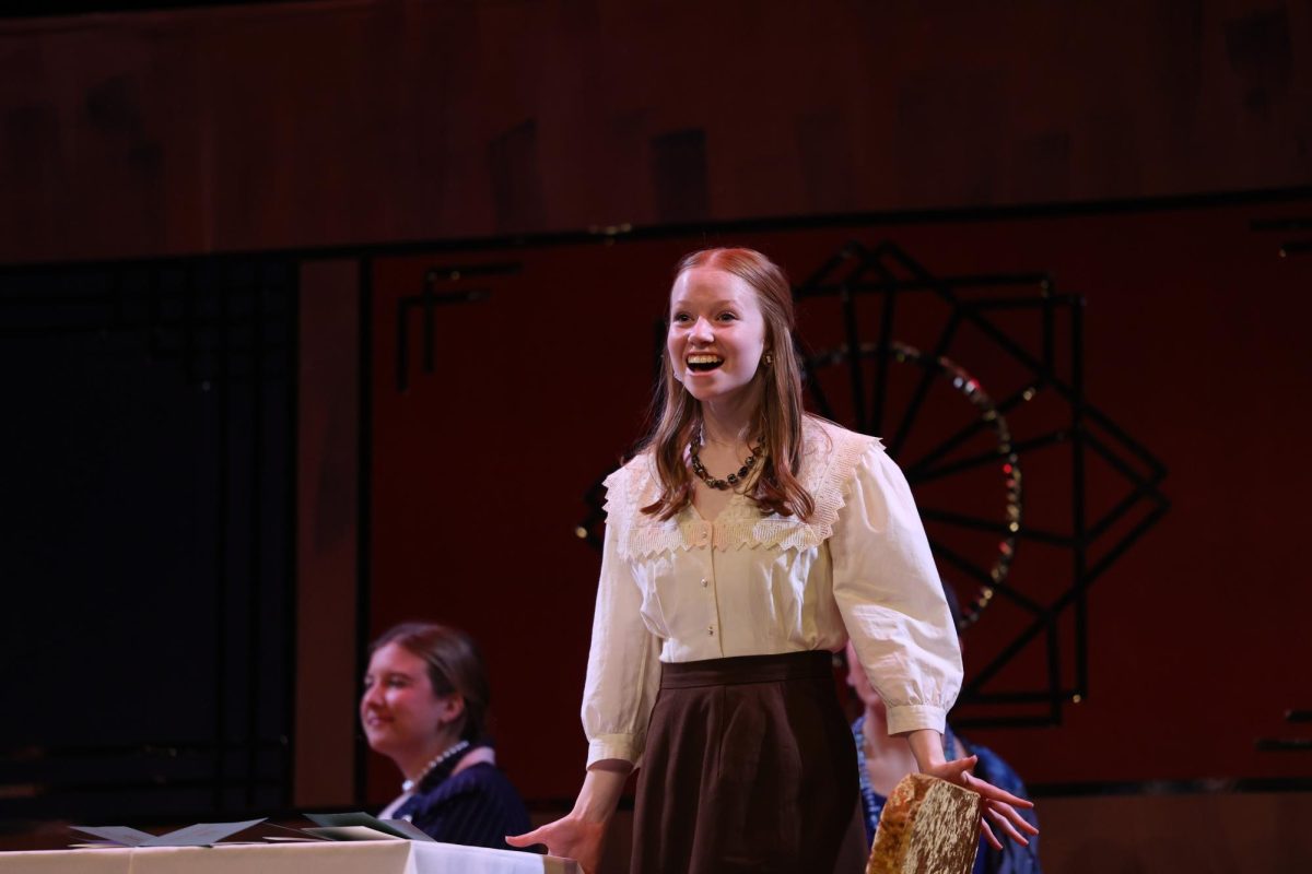 Sophomore Ingrid Morf (Mary Debenham) looks out to the audience.  