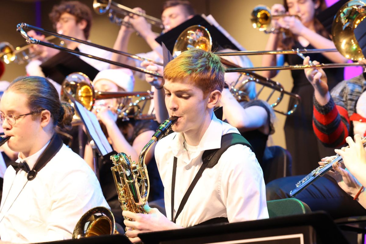 Aiden Campbell joins the jazz band in playing Rocking Angels at the Christmas concert. 