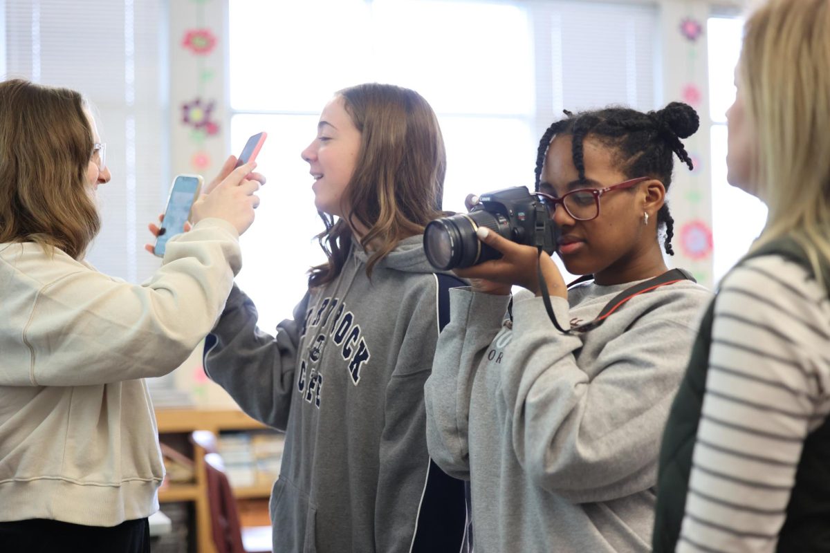 Sophomores Willa Turner, Cora Smith, Elena Gehrke, and Digital Media Instructor Mrs. Gage explore photography Jan. 3.