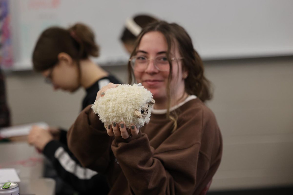 Junior Elsie Owen with her brand new crotchet sheep made in Stitching Together Jan. 11. 
