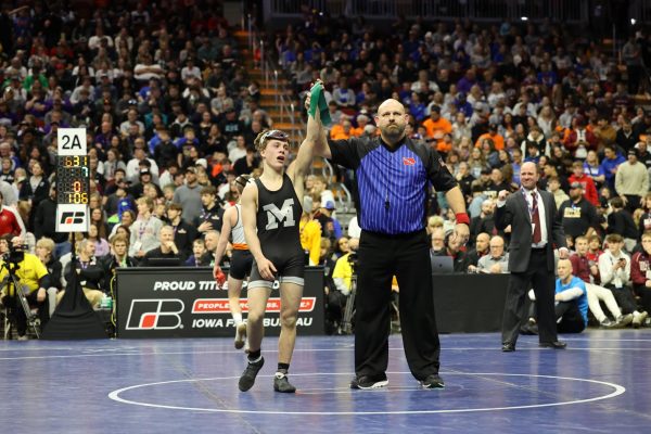 Senior Klayten Perreault gets his hand raised after his 7-1 championship win at the state wrestling tournament on Feb. 17. Perreault finished his senior season 46-0, his name being the most recent addition to the list of undefeated Mount Vernon wrestlers. 